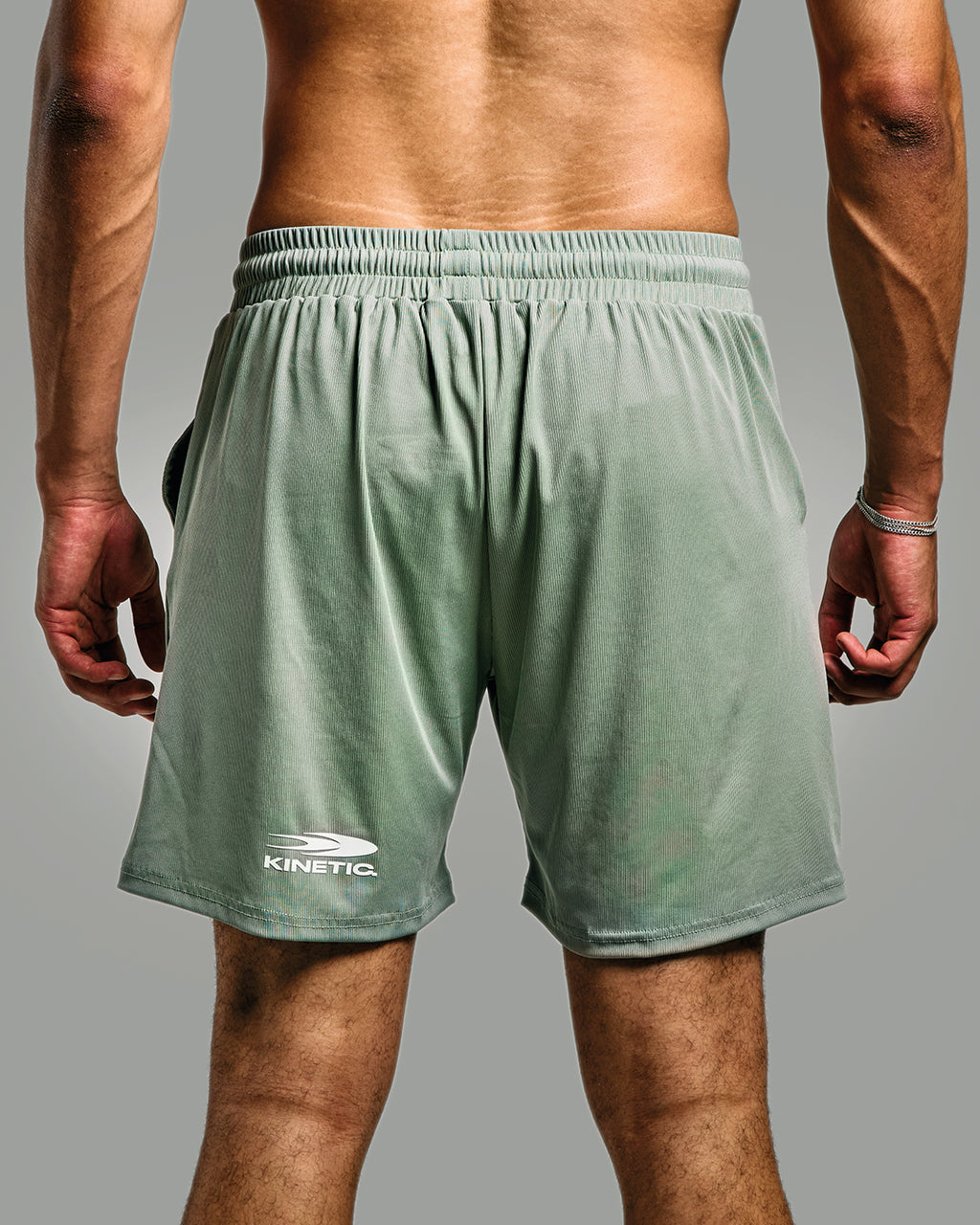Green Flow Athletic Fitness Short shown from the back with Kinetic logo
