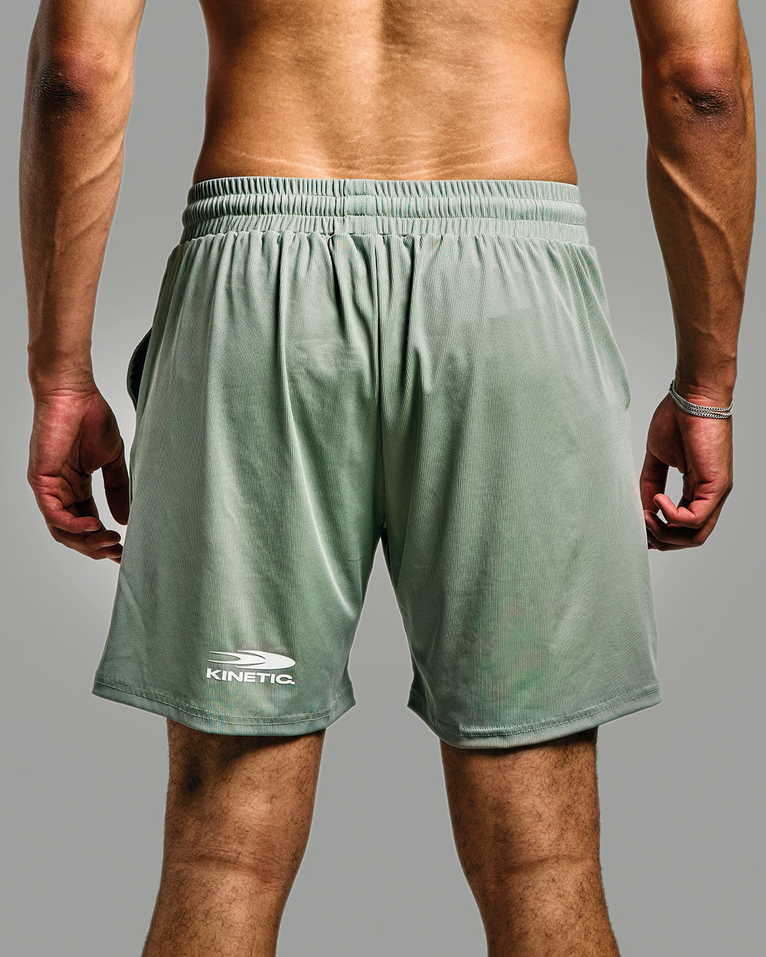 Green Flow Athletic Fitness Short shown from the back with Kinetic logo